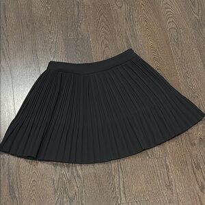 Plastic Island black pleated mini skirt Small